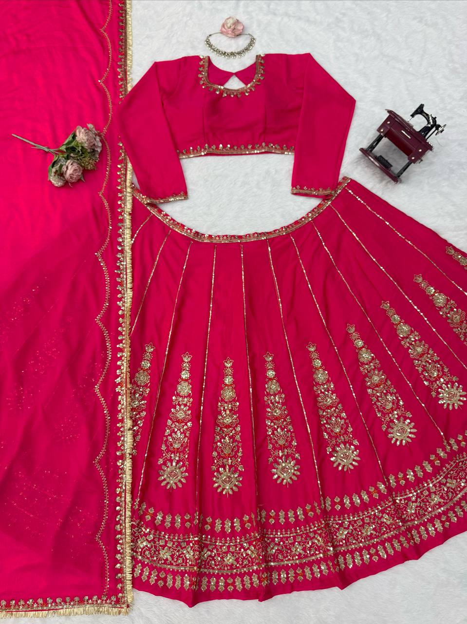 Radiant Rani Pink Silk Lehenga Choli Adorned with Opulent Heritage Floral Motifs and Intricate Zari Borders
